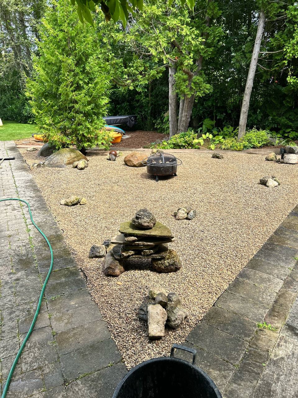 Gravel garden refresh with decorative stone features